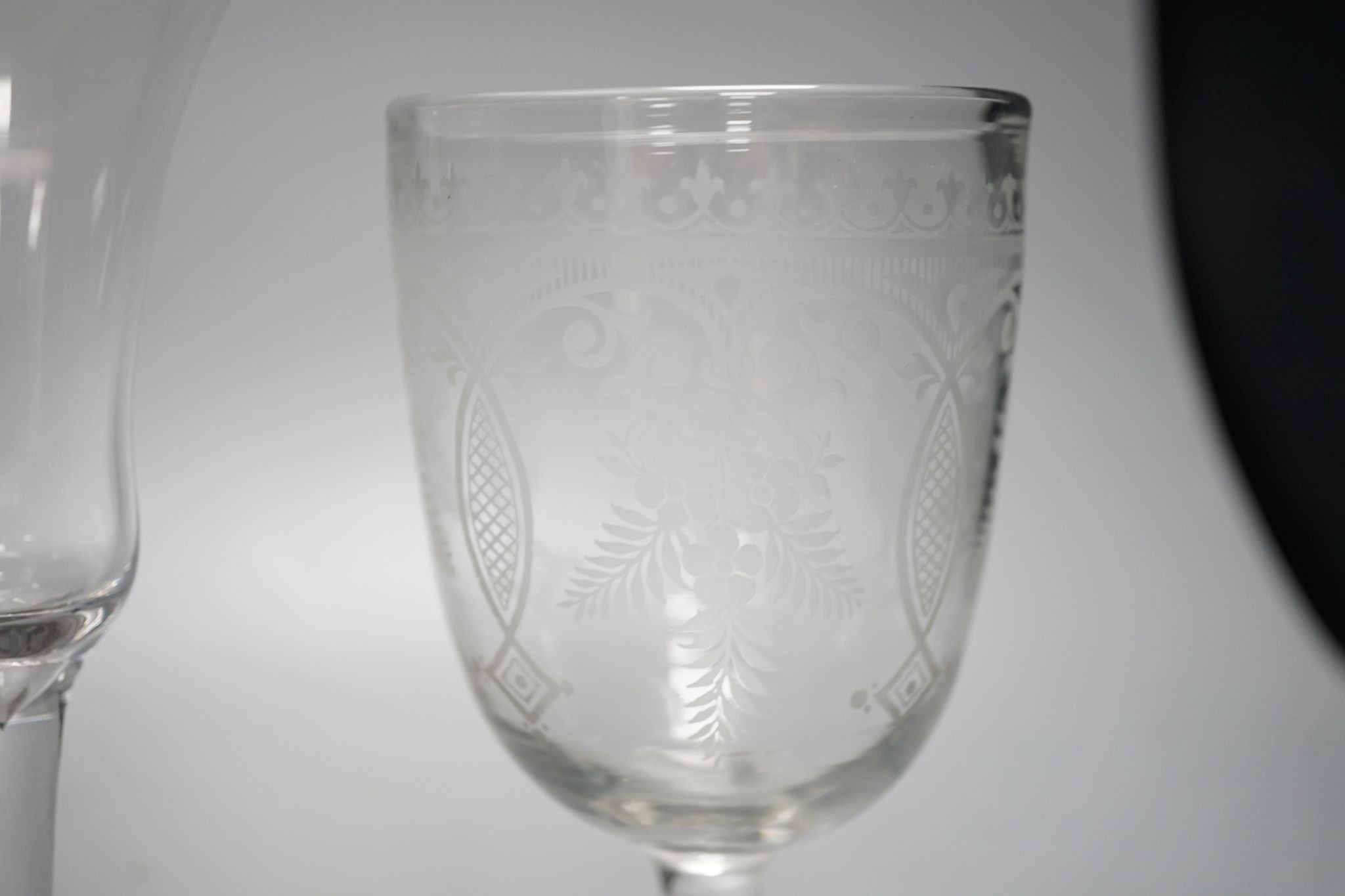 A mid 18th century trumpet bowled wine glass and three other glasses, 18cm